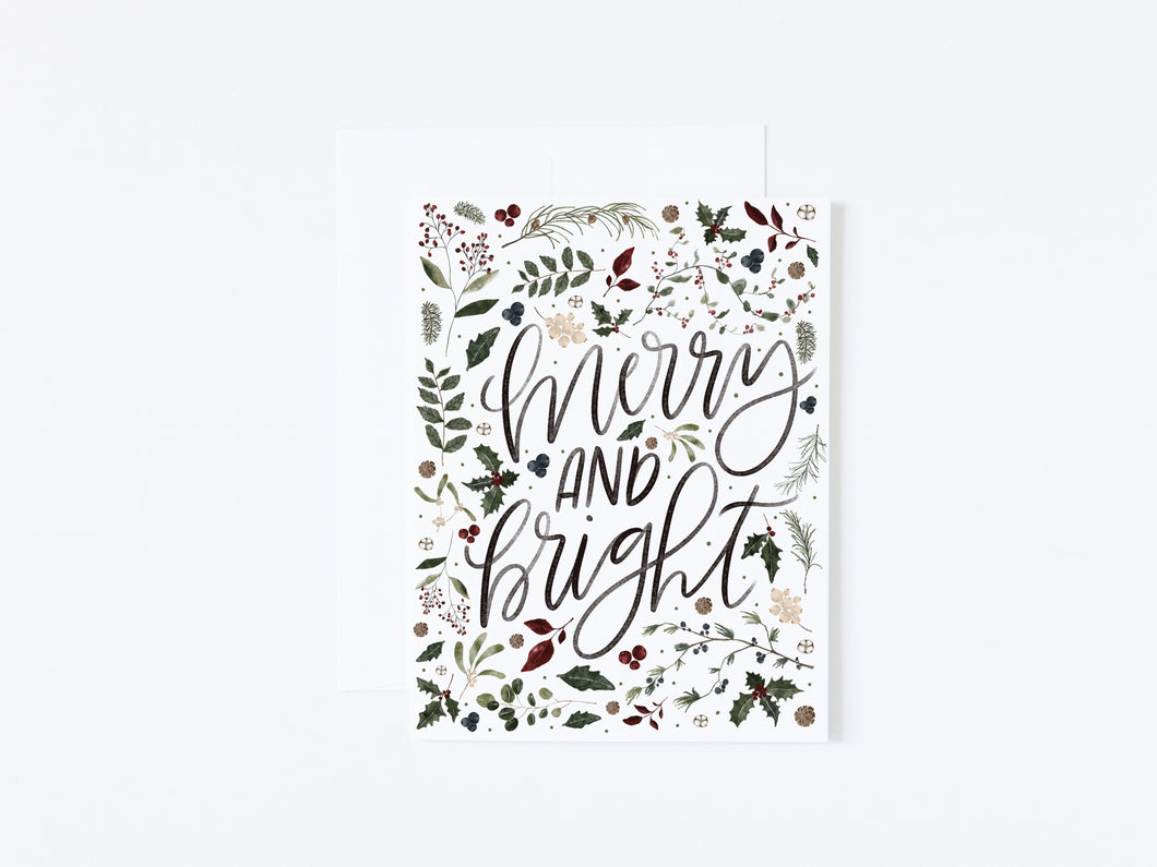 This charming watercolour Christmas card features festive holiday foliage that will bring joy to everyone on your card list. 